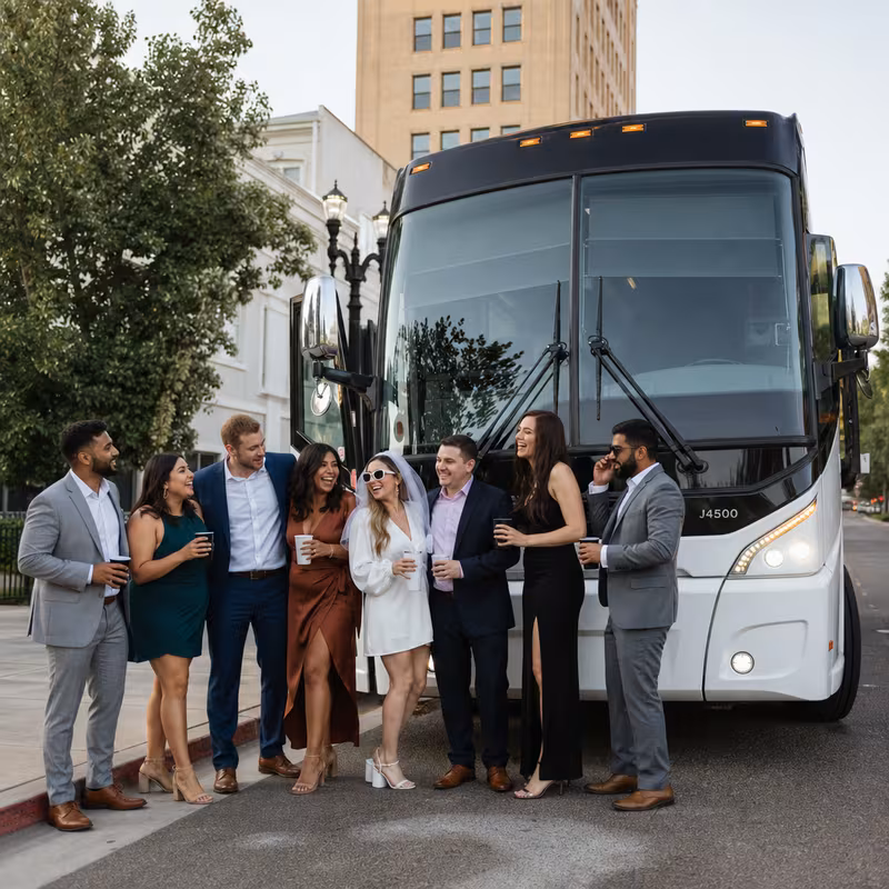 Passengers loading luggage while boarding an Fresno group shuttle