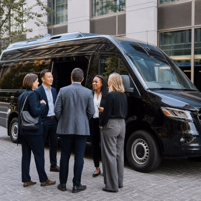 Party bus interior with wraparound leather seating and LED lighting in Fresno
