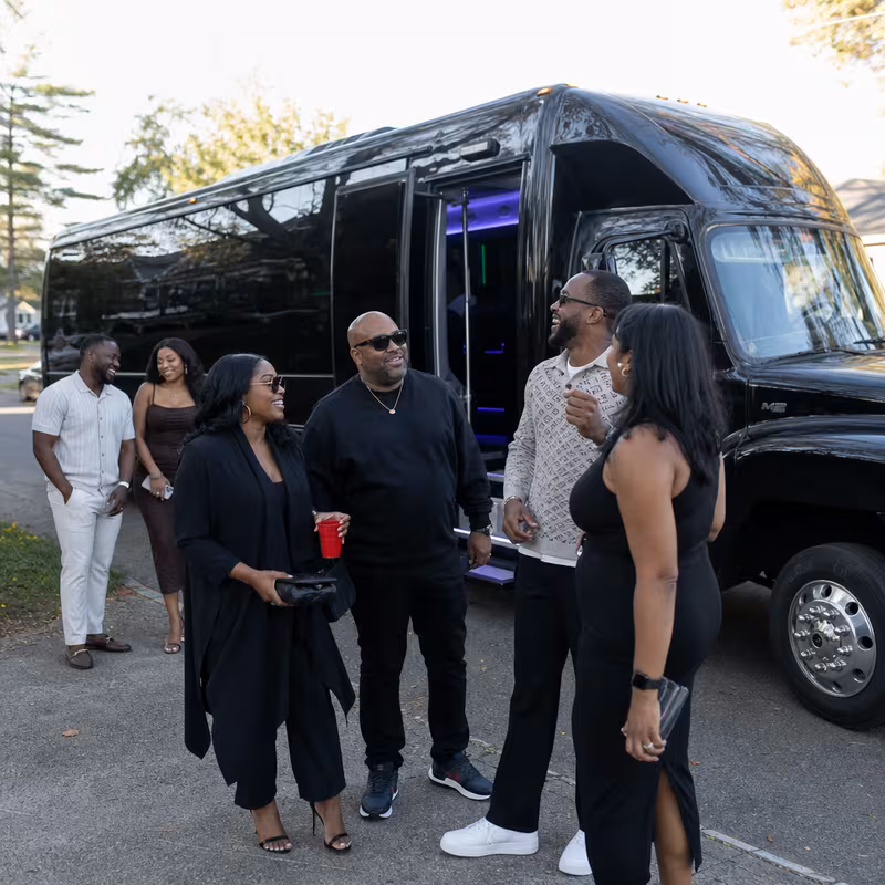 Passengers loading luggage while boarding an Fresno group shuttle