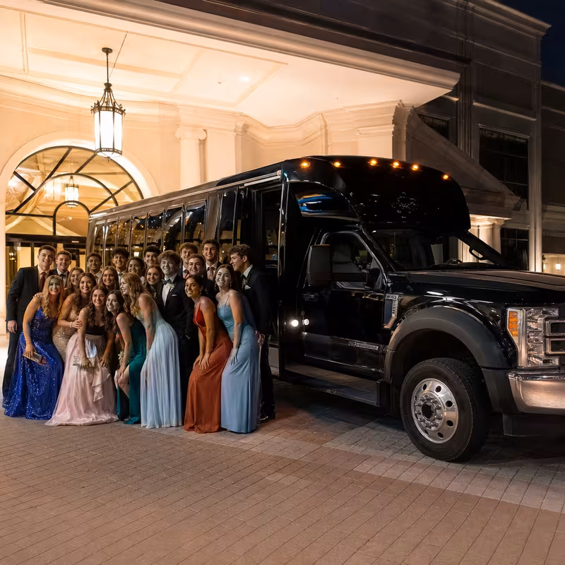 Party bus interior with wraparound leather seating and LED lighting in Fresno