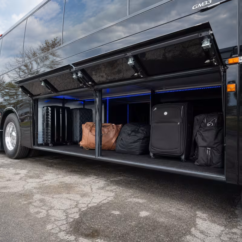 Party bus interior with wraparound leather seating and LED lighting in Fresno