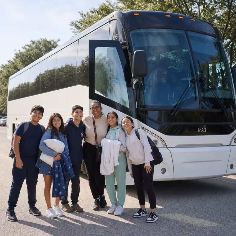 Passengers loading luggage while boarding an Fresno group shuttle