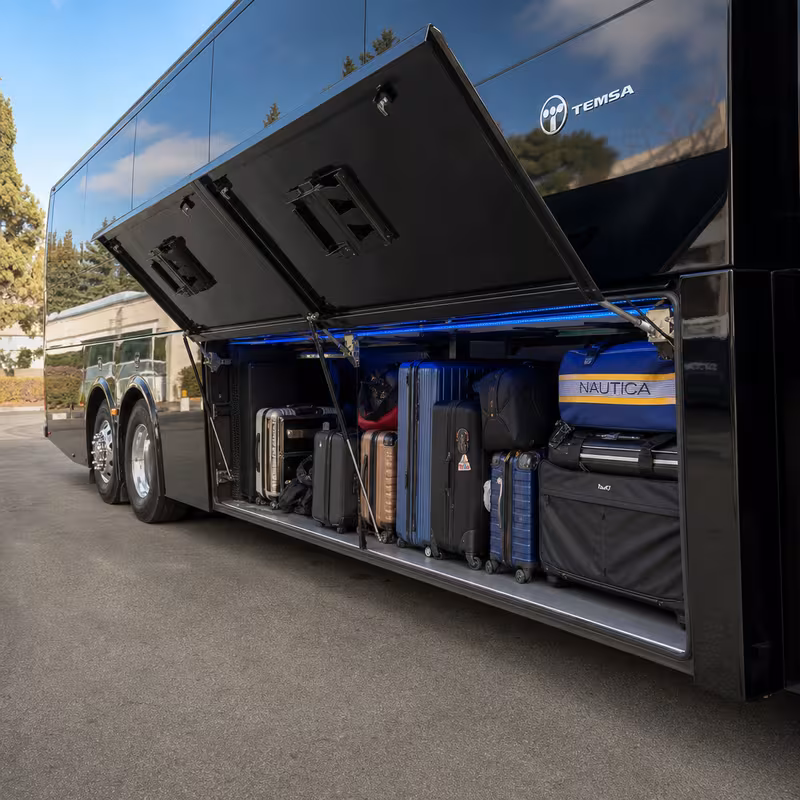 Party bus interior with wraparound leather seating and LED lighting in Fresno