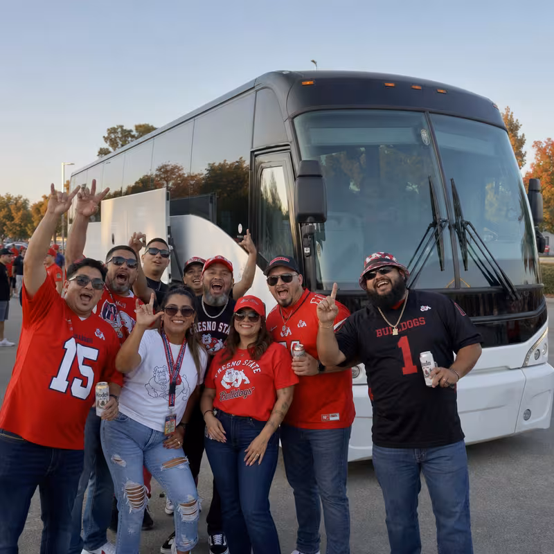Passengers loading luggage while boarding an Fresno group shuttle