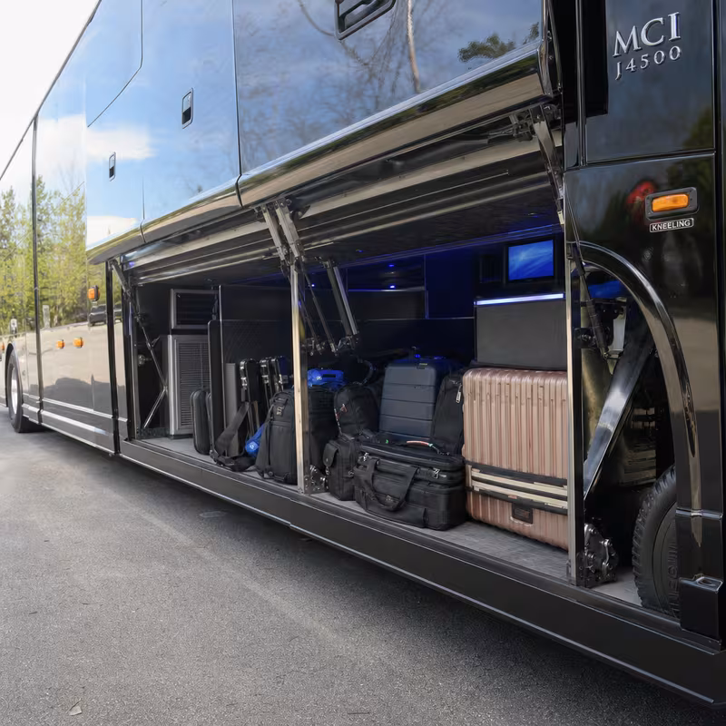Party bus interior with wraparound leather seating and LED lighting in Fresno